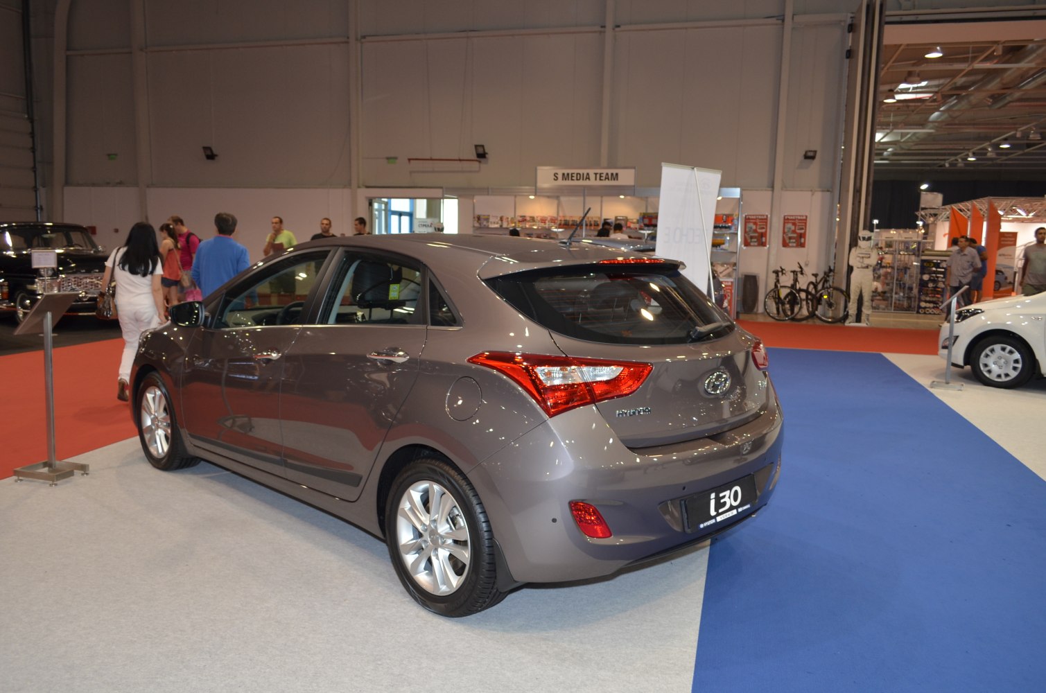 Rear three-quarter view of a hatchback with distinctive taillights and alloy wheels