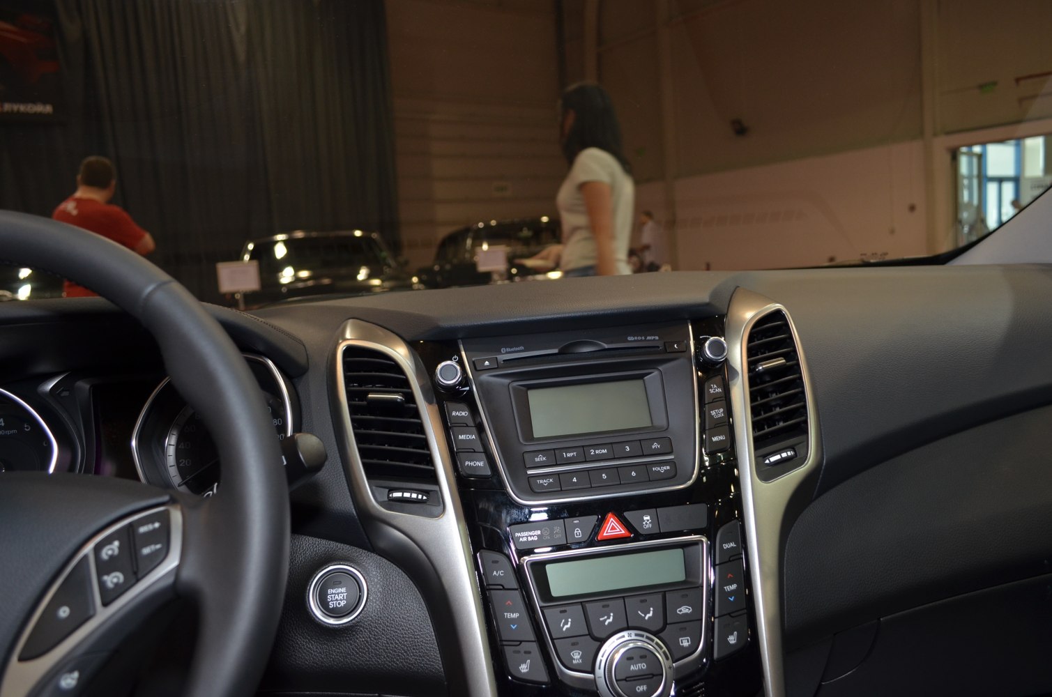 Center console with multimedia system, climate control, and steering wheel details