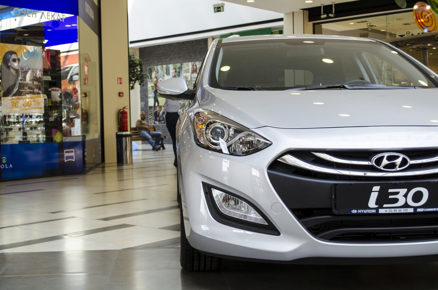 Close-up of car front with detailed headlights and grille design