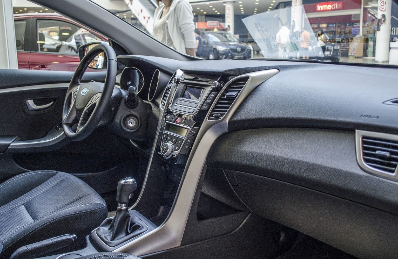Dashboard and manual gear shift with steering wheel and seating