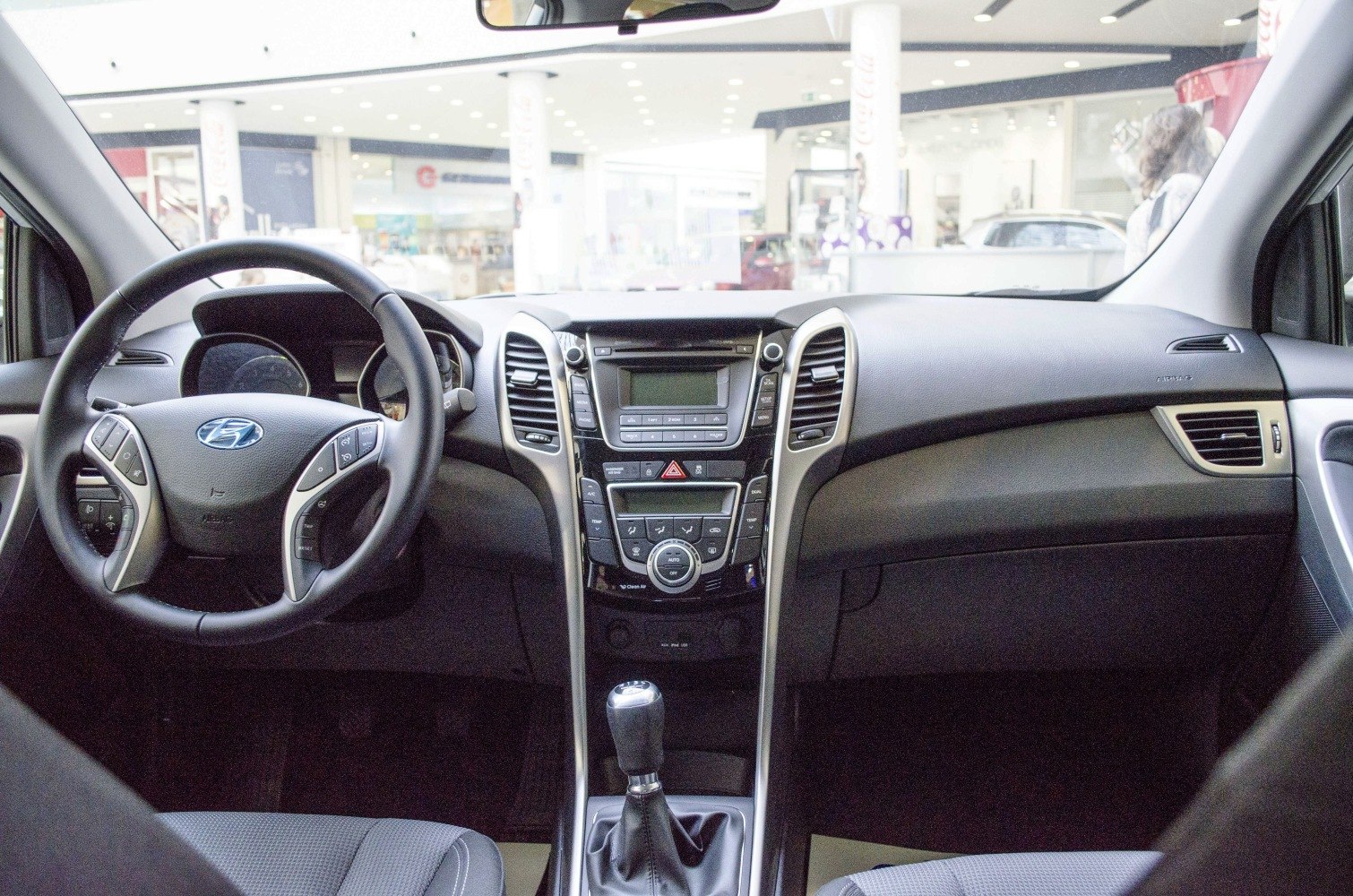 Steering wheel and central dashboard with controls