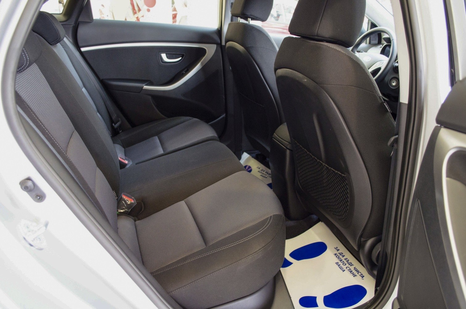 Spacious rear seat area with fabric upholstery and ergonomic design