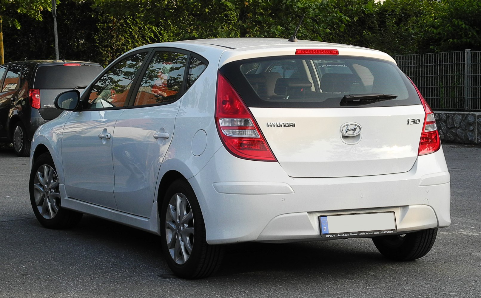 Rear hatchback view with taillights and badge details
