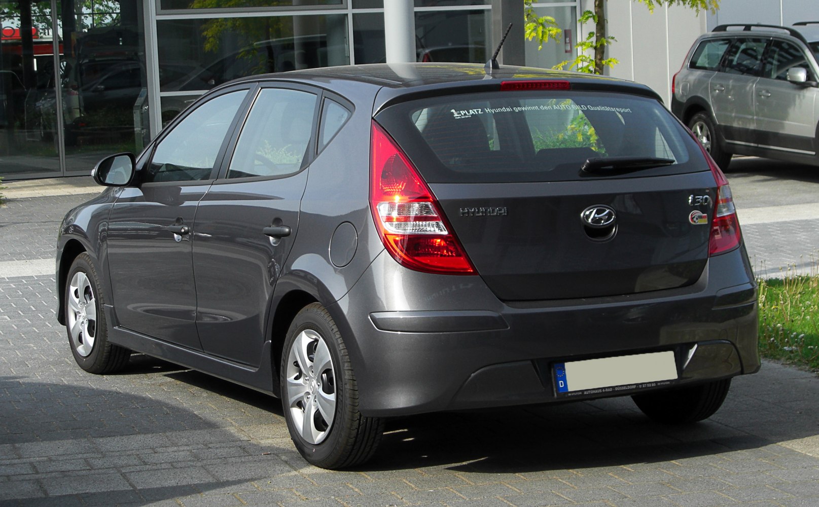 Rear view of hatchback with distinctive taillights and rear window design
