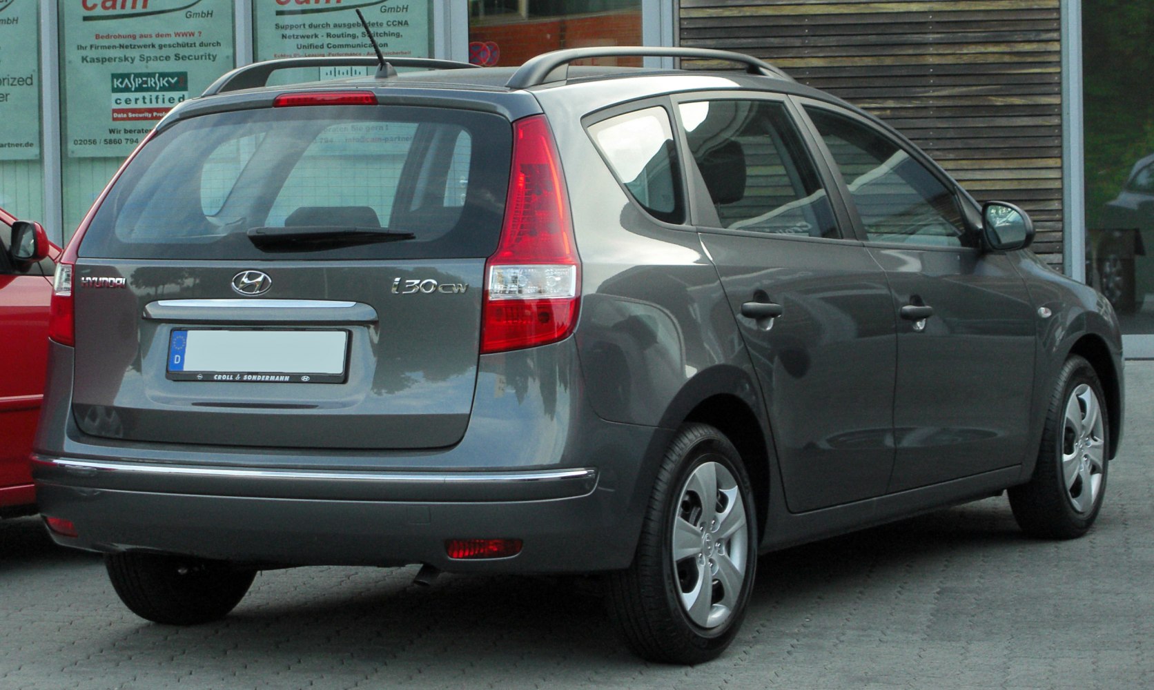 Rear and side view of station wagon with roof rails and rear windshield wiper