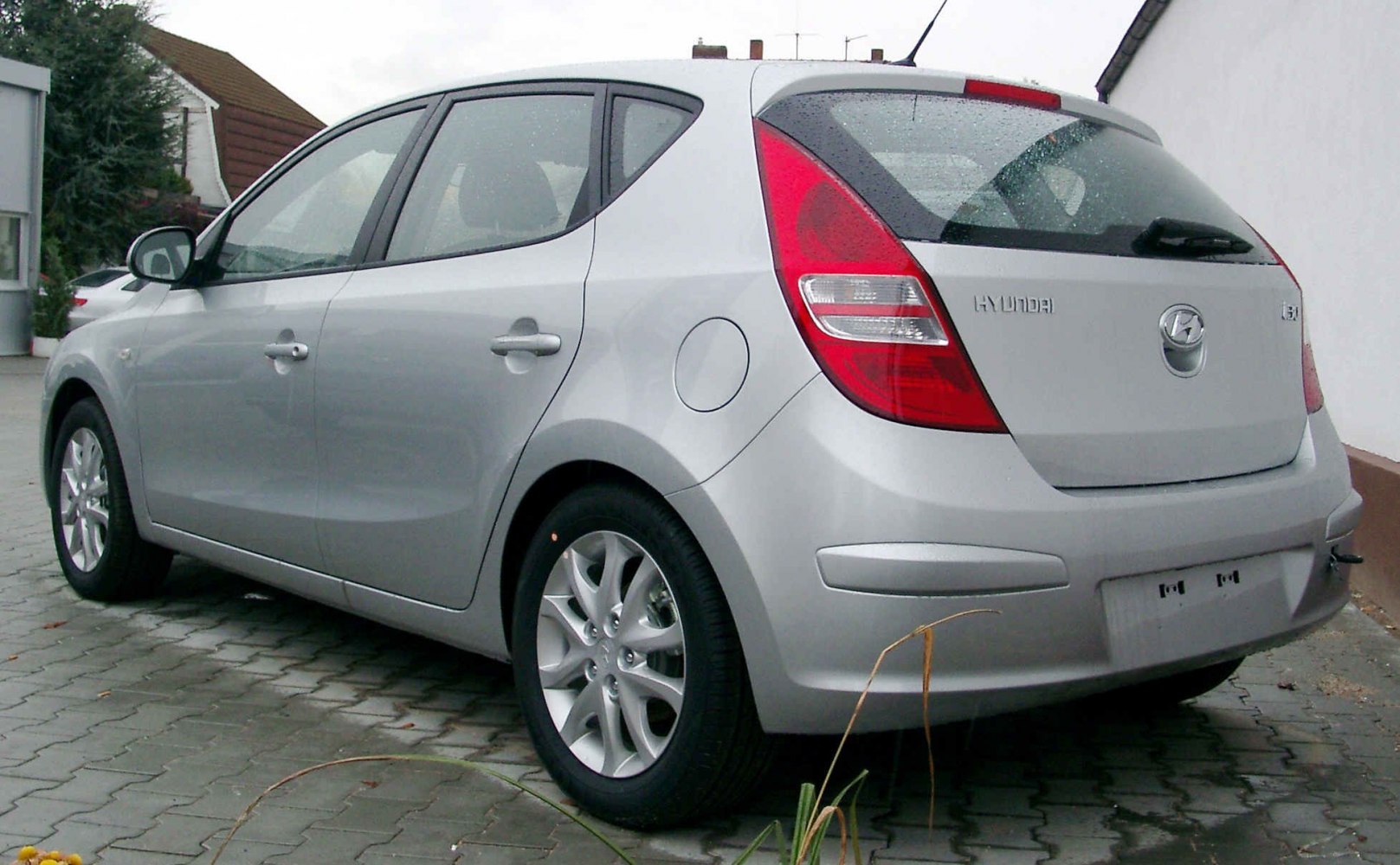 Silver hatchback rear-side view with rear light cluster and alloy wheels