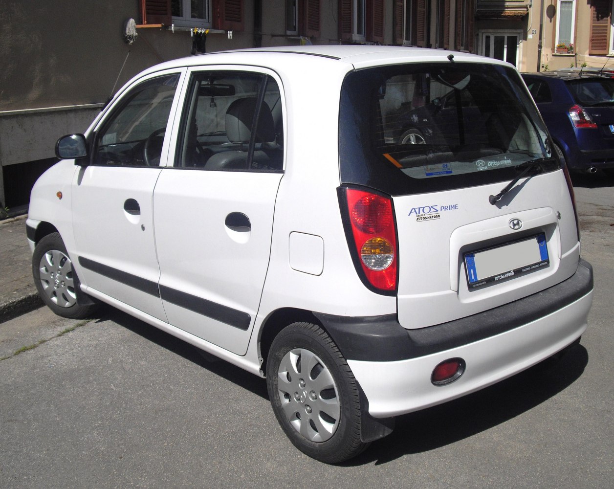 Rear side view of compact hatchback with distinctive taillights