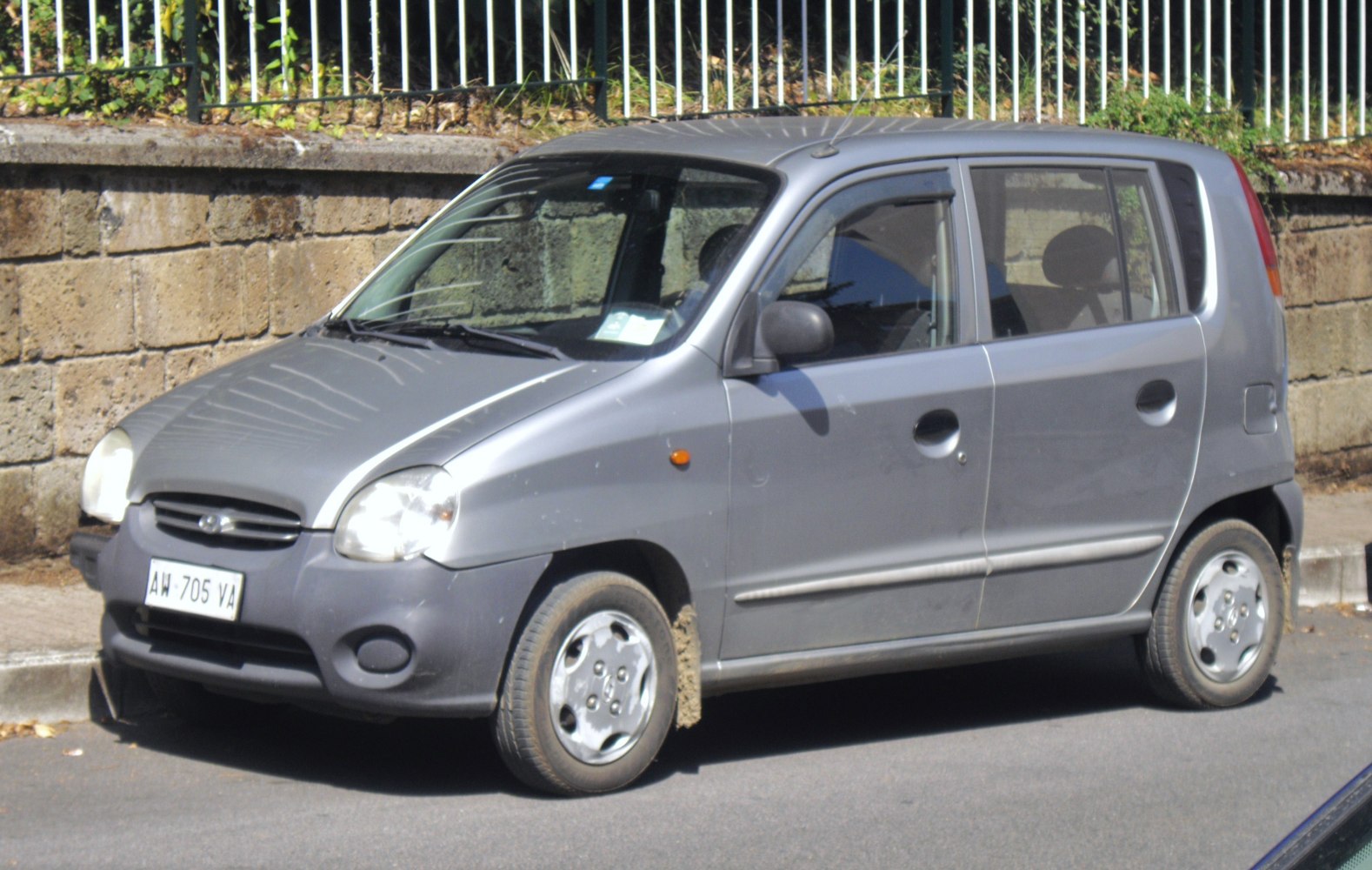 Compact hatchback with rounded headlights and four doors