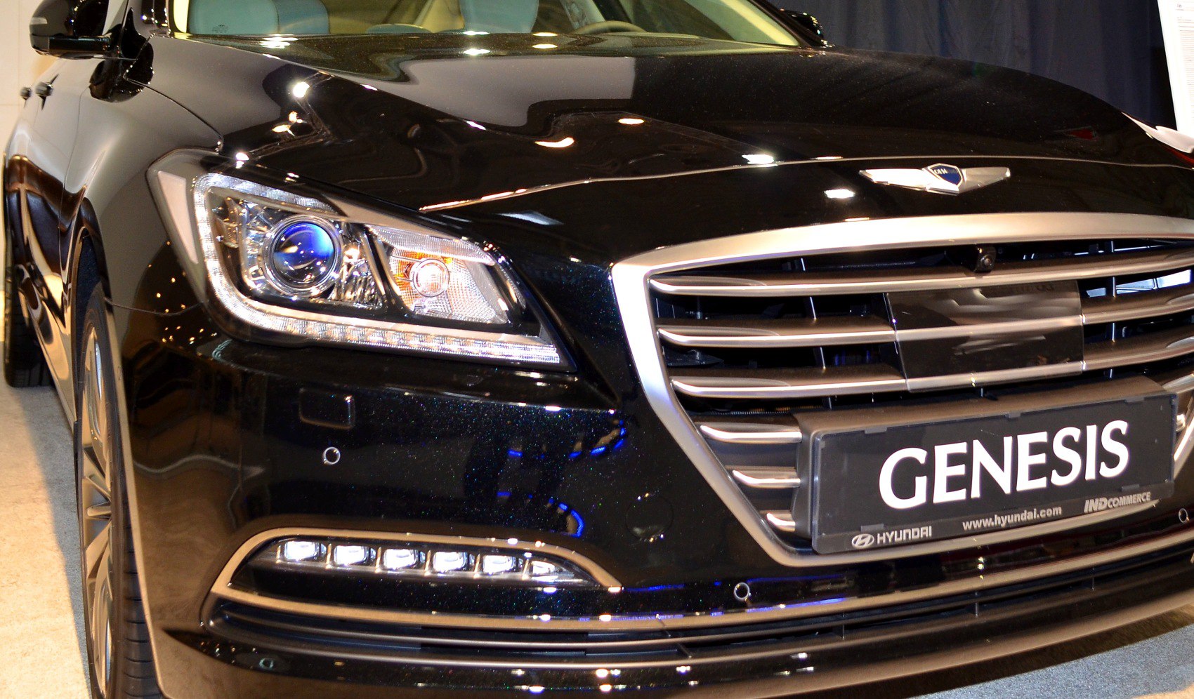 Front grille and LED headlight close-up with chrome accents