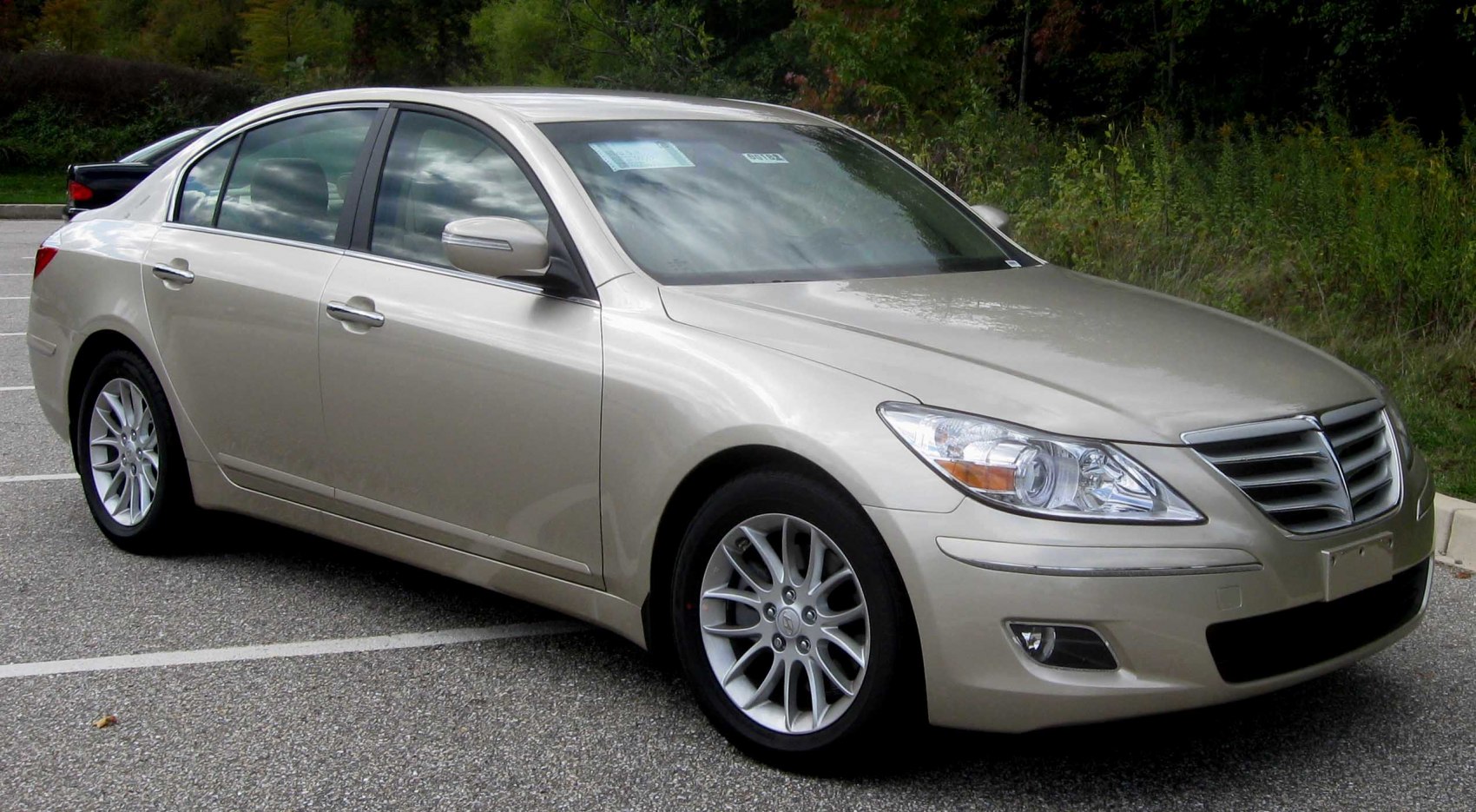 Elegantly styled sedan front and side with sleek headlights and grille