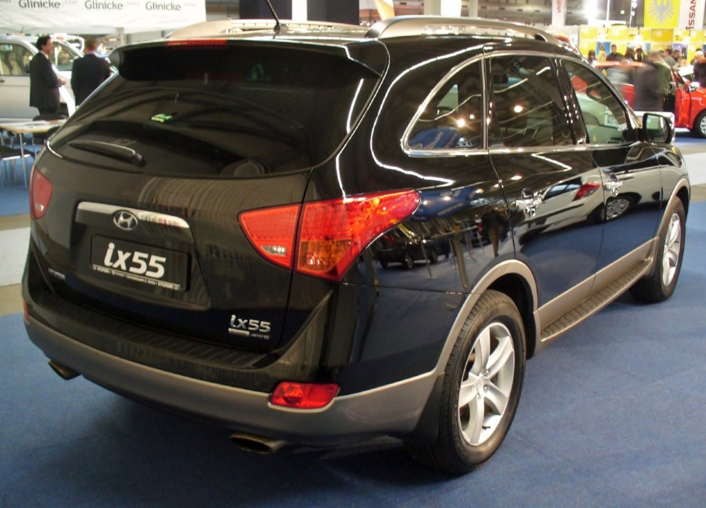 Rear and side view of black SUV with alloy wheels and tinted windows
