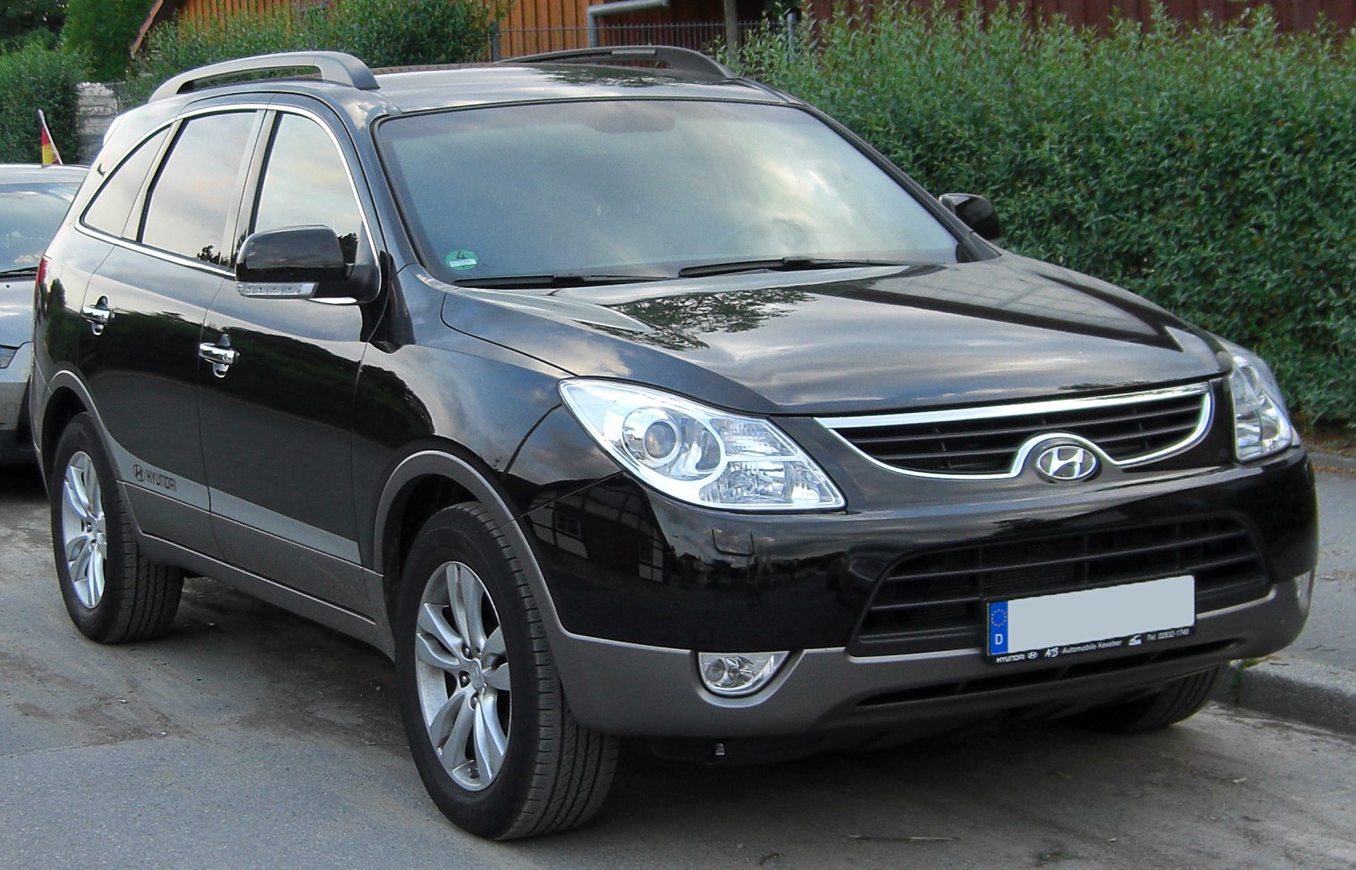 SUV with large alloy wheels and distinct front grille
