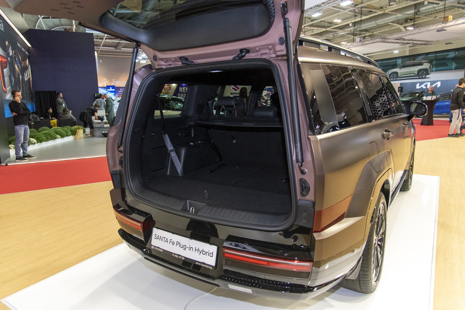 Rear cargo space and open tailgate of modern SUV with tinted windows