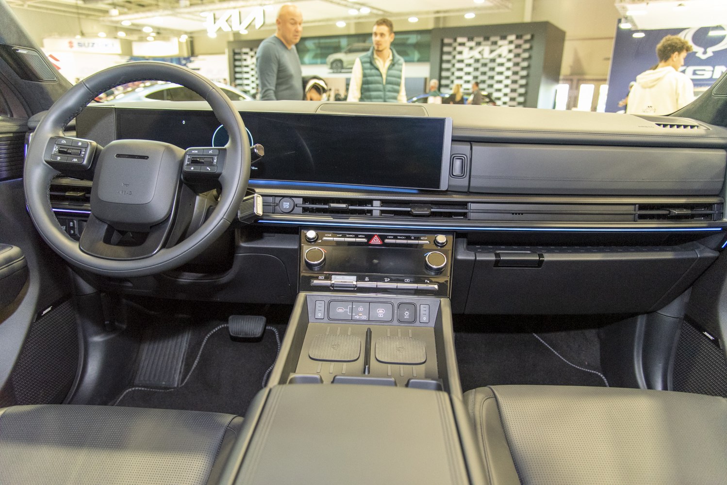 Modern dashboard and steering wheel with digital displays and controls