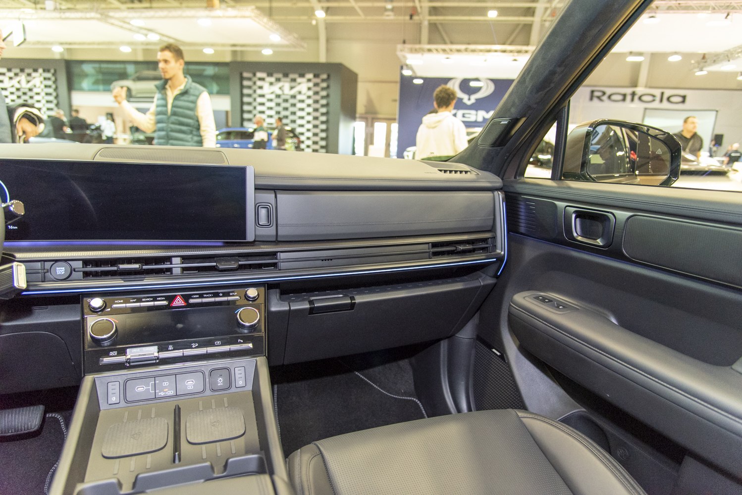 Modern dashboard and center console with infotainment screen and cup holders