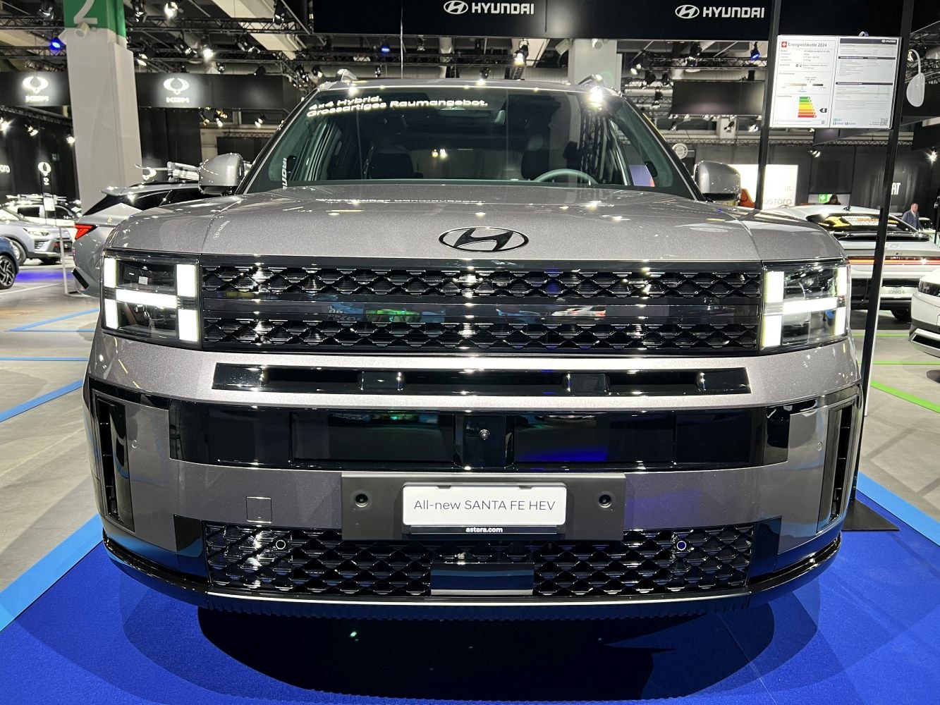 Front grille and distinctive LED headlights of a modern SUV
