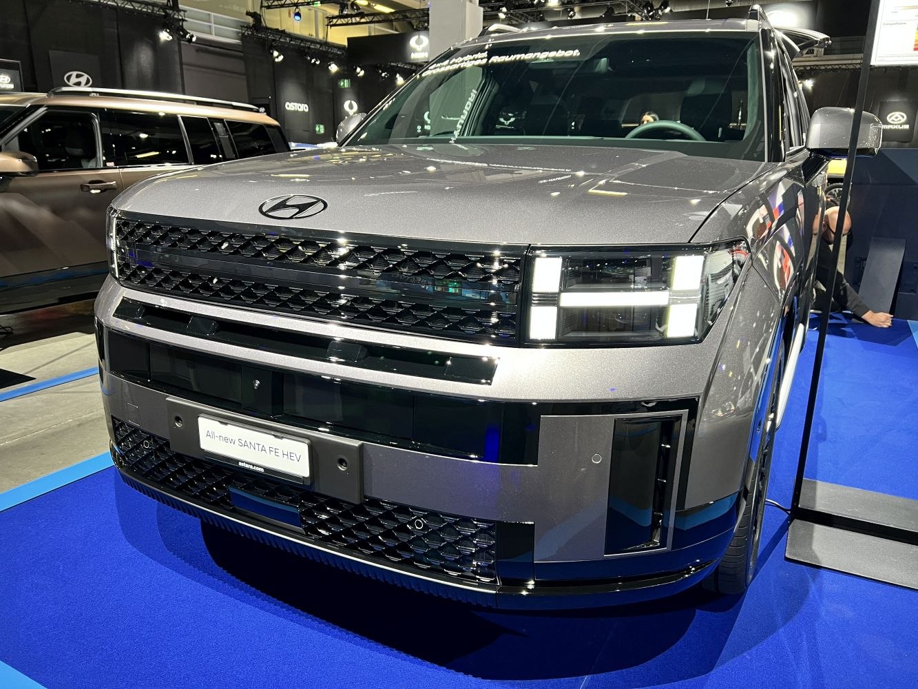 Bold front grille with distinctive LED headlights on a modern SUV.