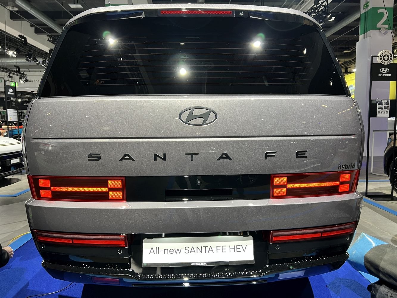 Rear view of modern hybrid SUV with distinctive rectangular tail lights.