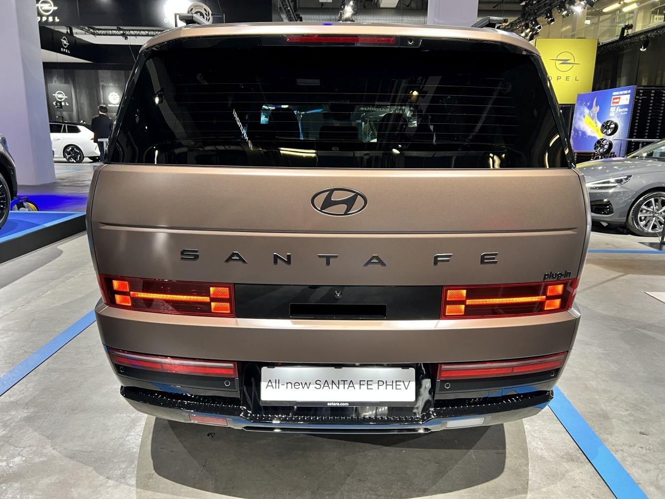 Rear view with illuminated geometric taillights and prominent badging