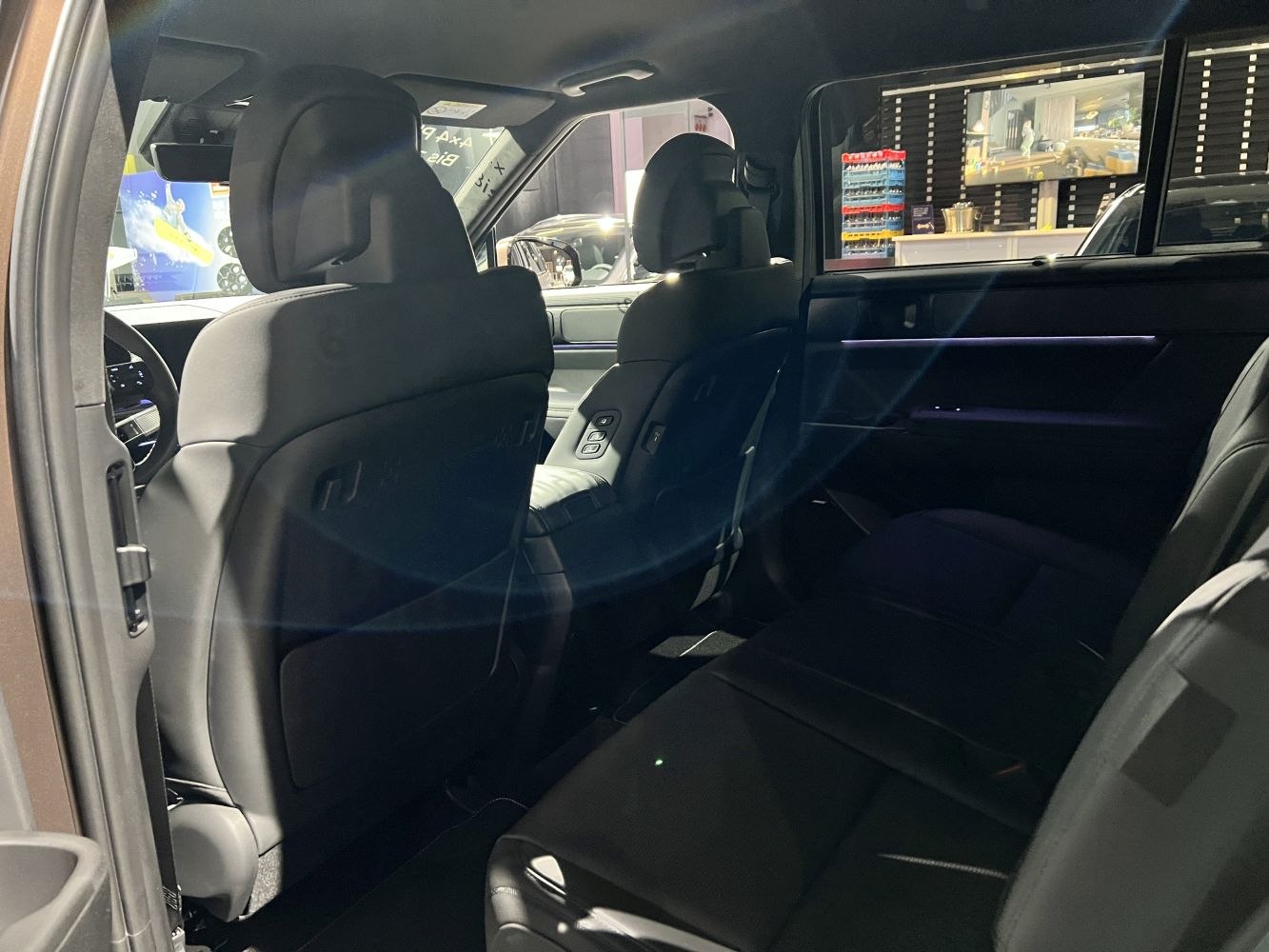 Rear seat interior with ambient lighting and seat controls