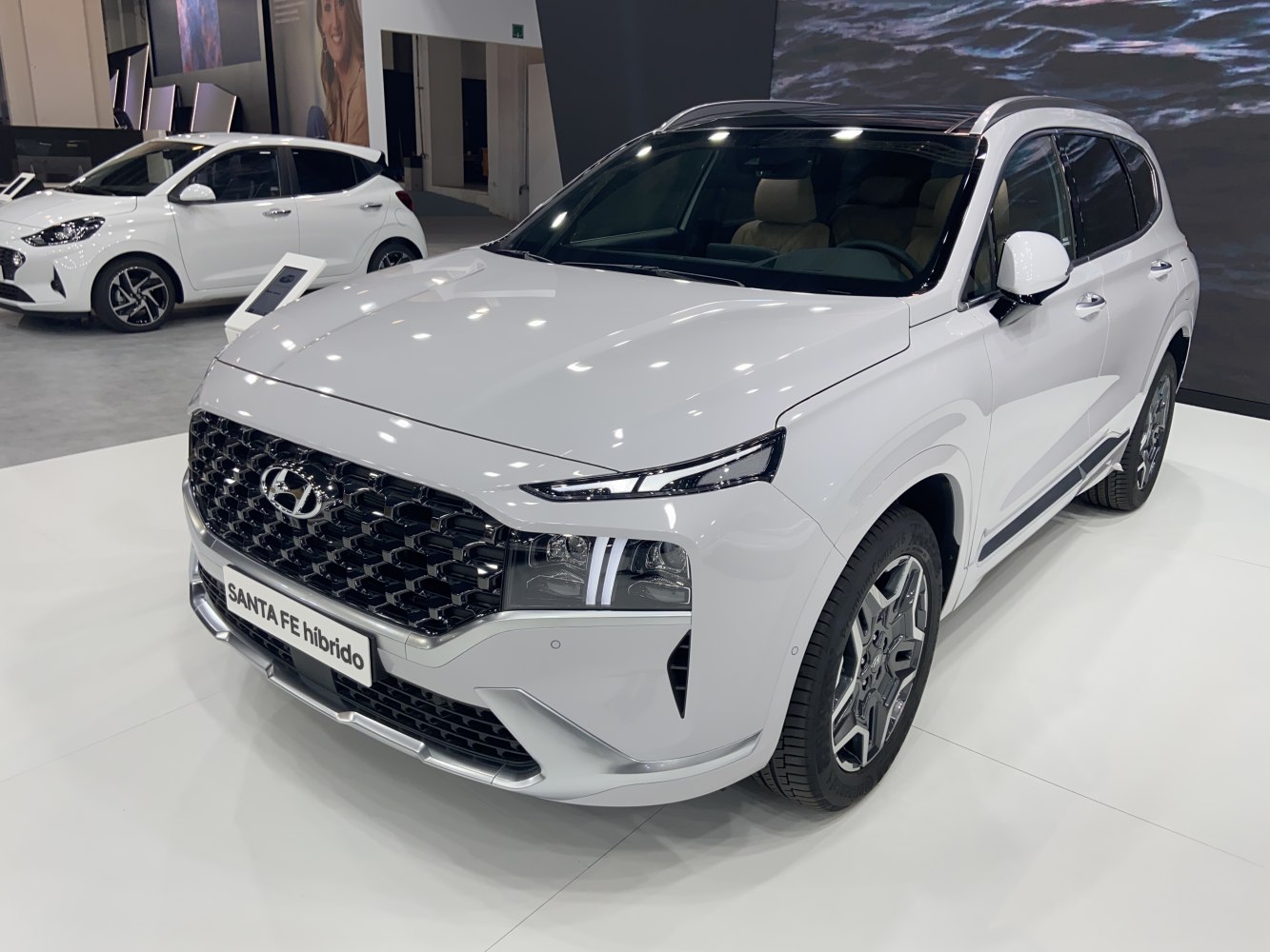 Front view of a hybrid SUV with bold grille and LED headlights