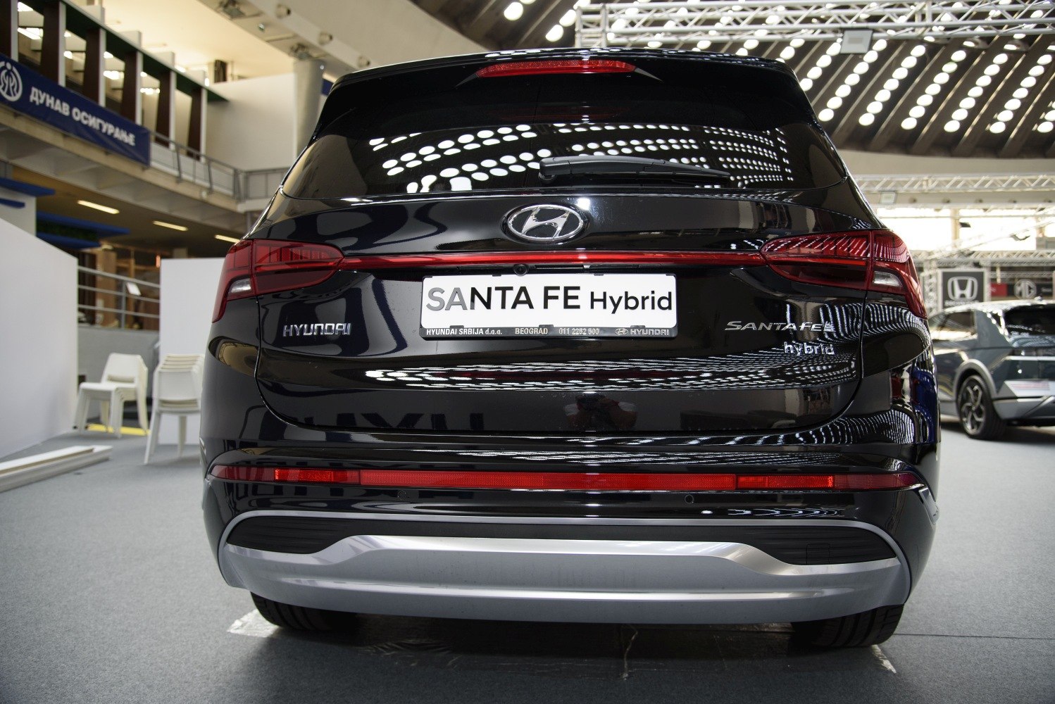 Rear view of hybrid SUV with connected tail lights and branding