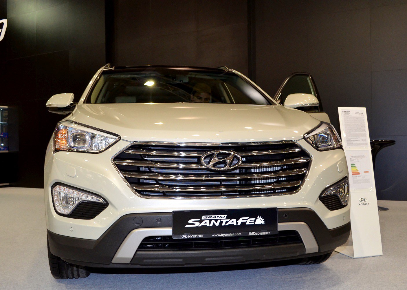 Front view showing chrome grille and headlights of SUV
