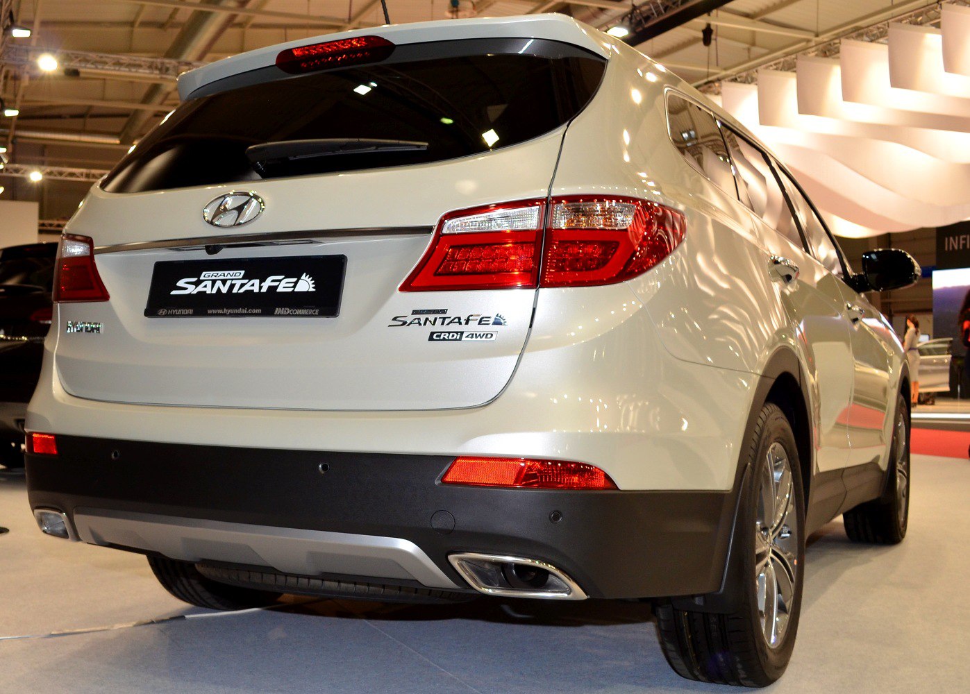 Rear view with taillights, CRDi 4WD badge, and dual exhaust outlets