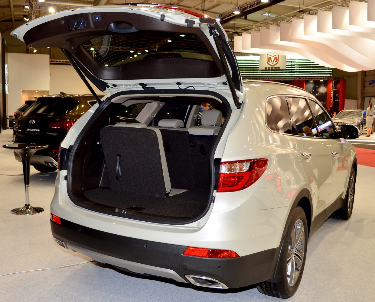 Rear view with open tailgate and foldable rear seats of an SUV