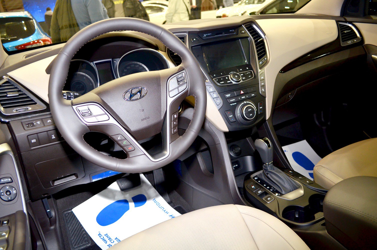 Steering wheel and dashboard with center console and gear shift