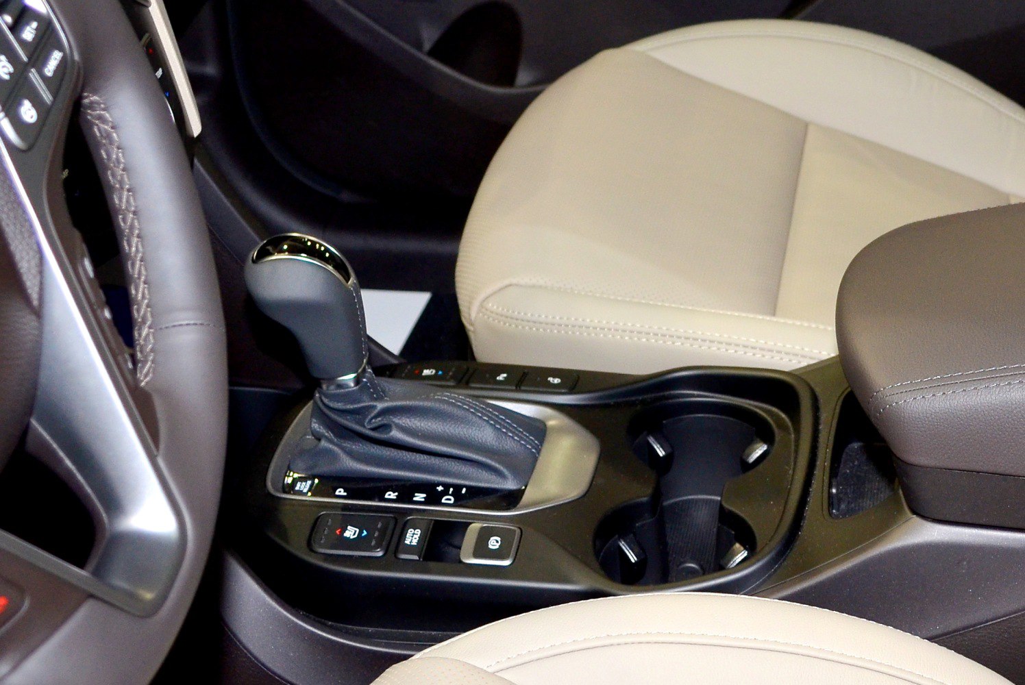 Gear shift lever, electronic parking brake, dual cup holders in car center console