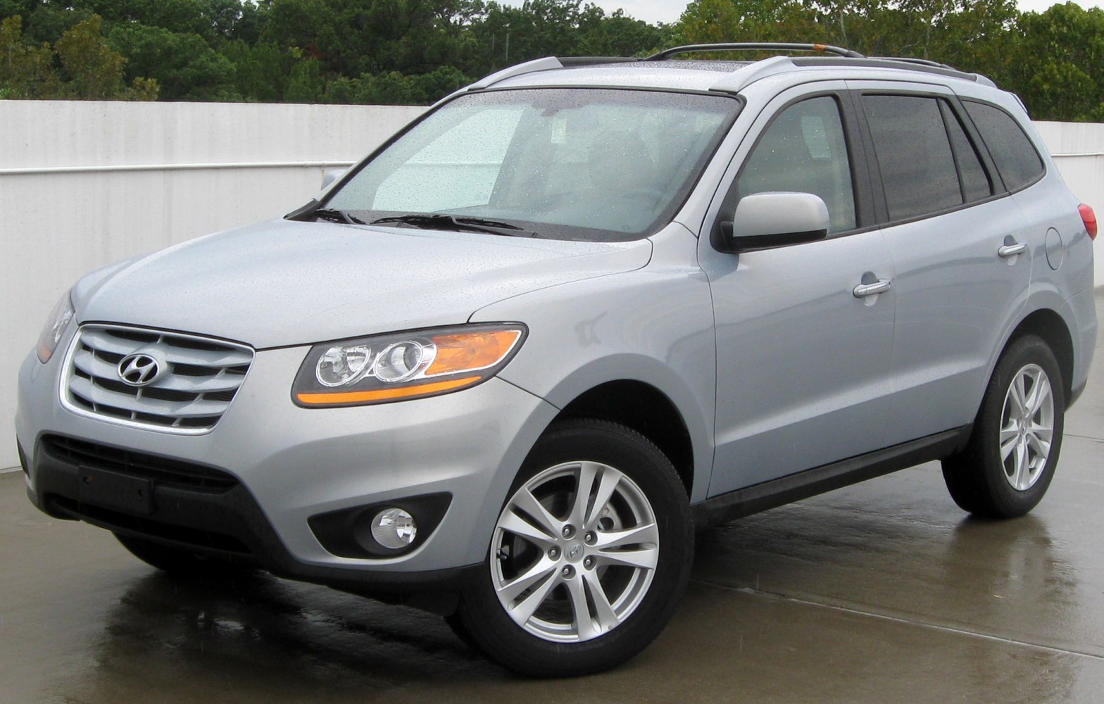 Silver mid-size SUV with distinctive headlights and alloy wheels, front side view