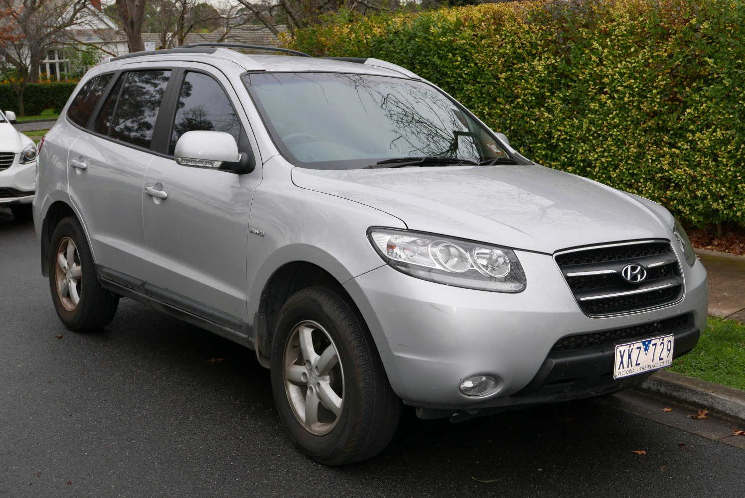 Silver SUV front side with roof rails and fog lights