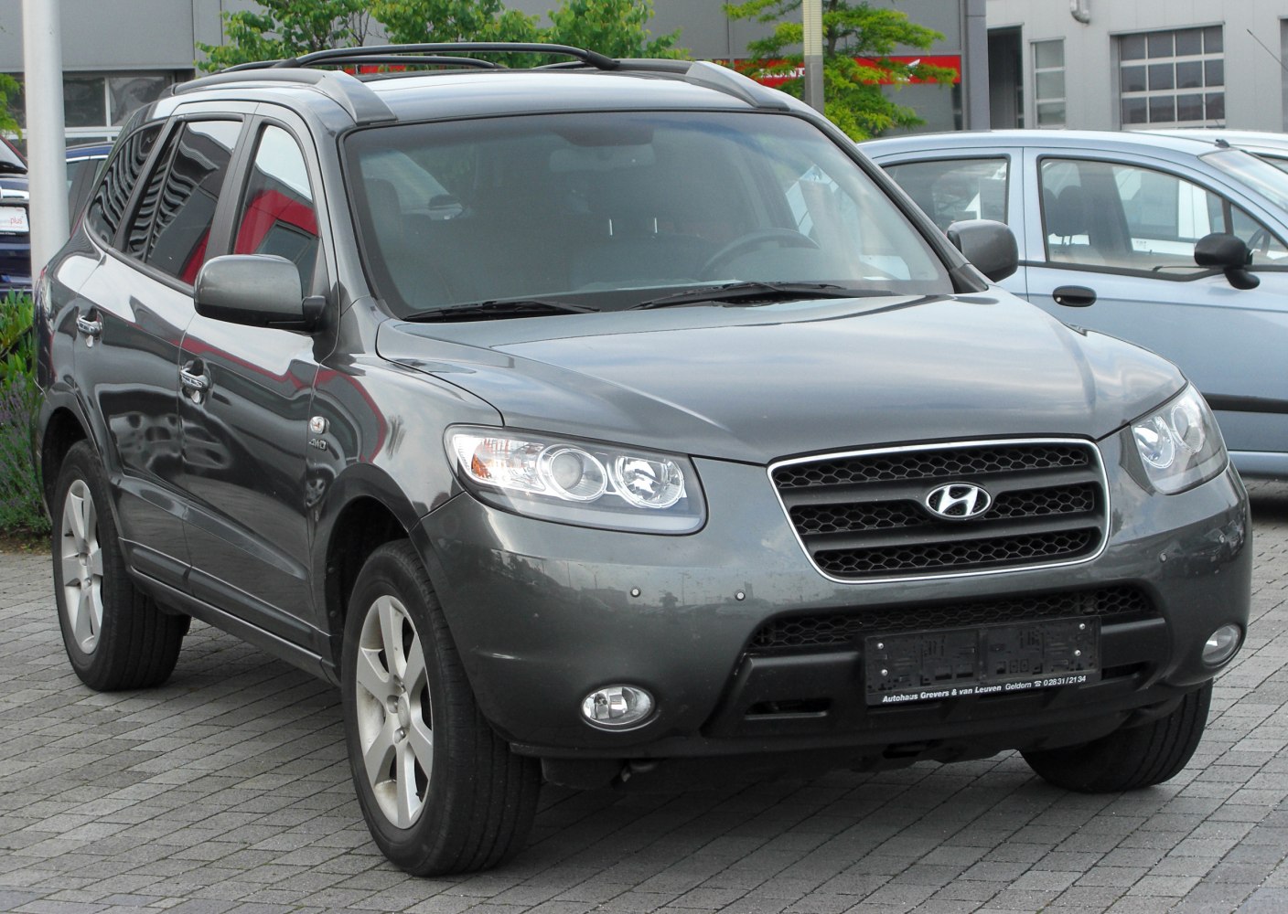 Front angled view of SUV with prominent grille and sleek headlights