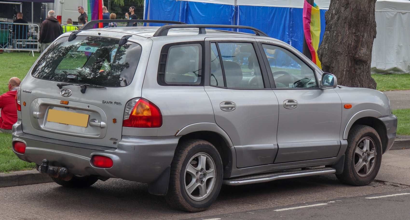 Silver SUV rear and side view with roof rails and alloy wheels