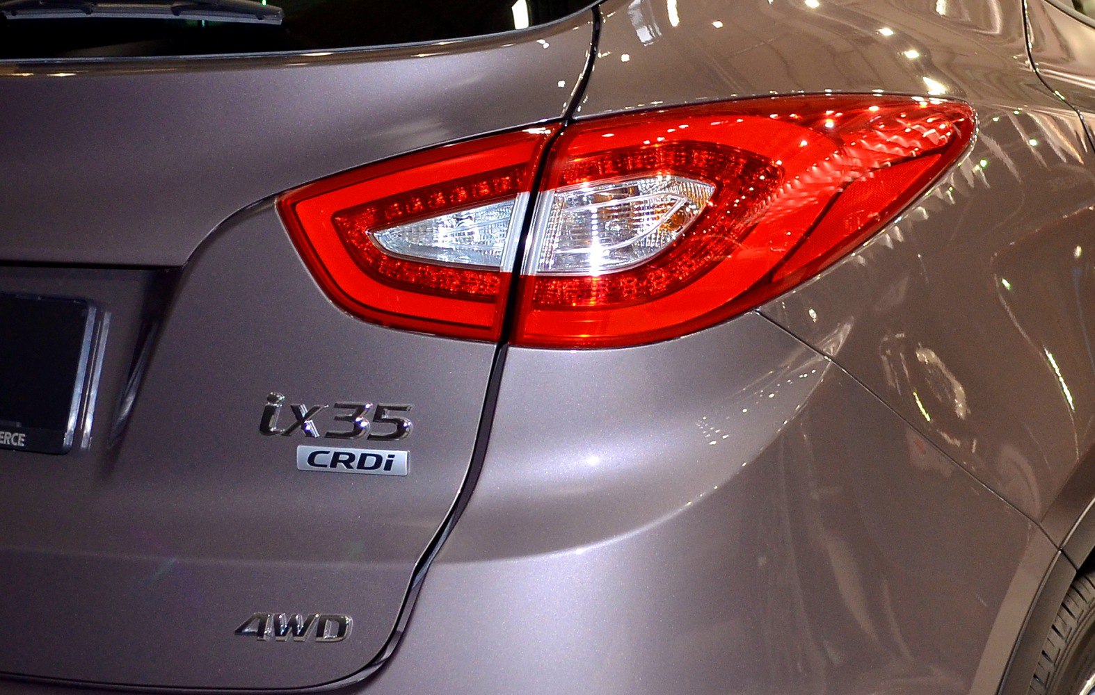 LED rear taillight with 4WD and CRDi badges on metallic gray body