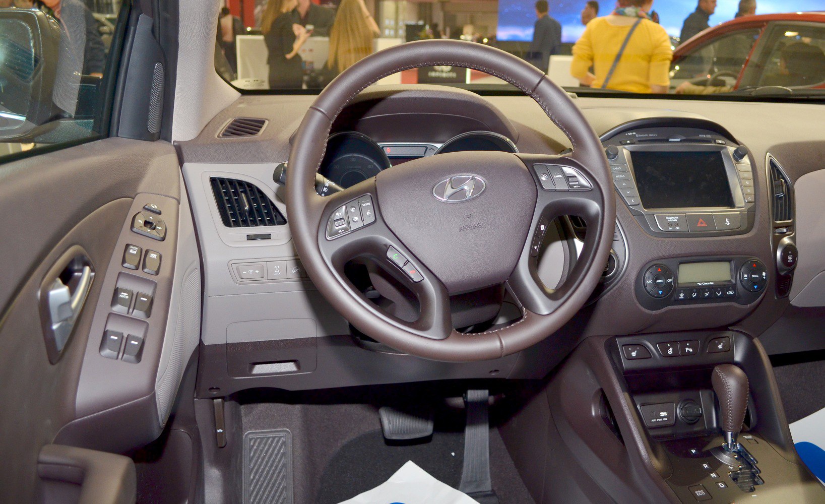 Steering wheel and dashboard with infotainment and climate controls
