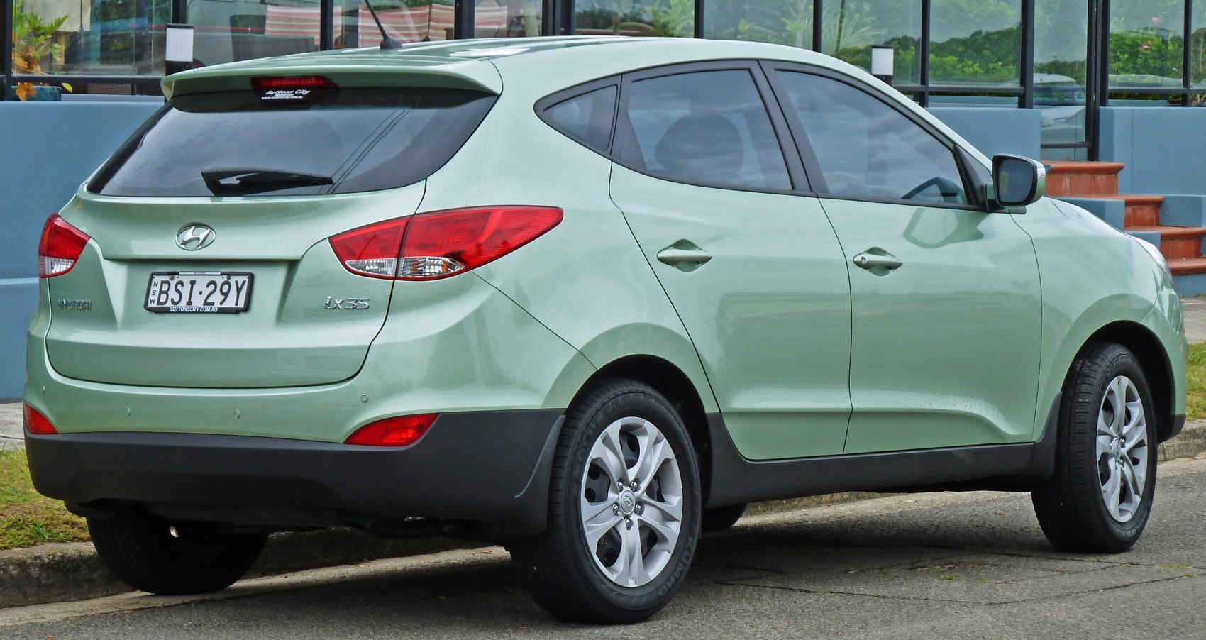 Rear side view of compact SUV hatchback with distinct taillights and alloy wheels