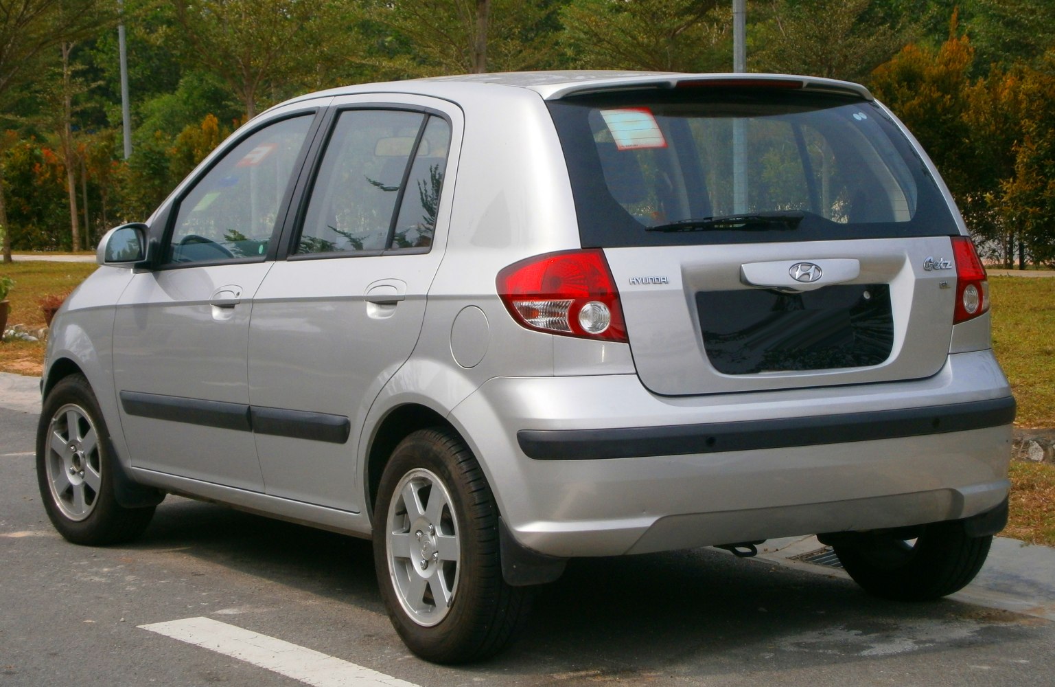 Rear side view of compact hatchback with alloy wheels and distinct taillights