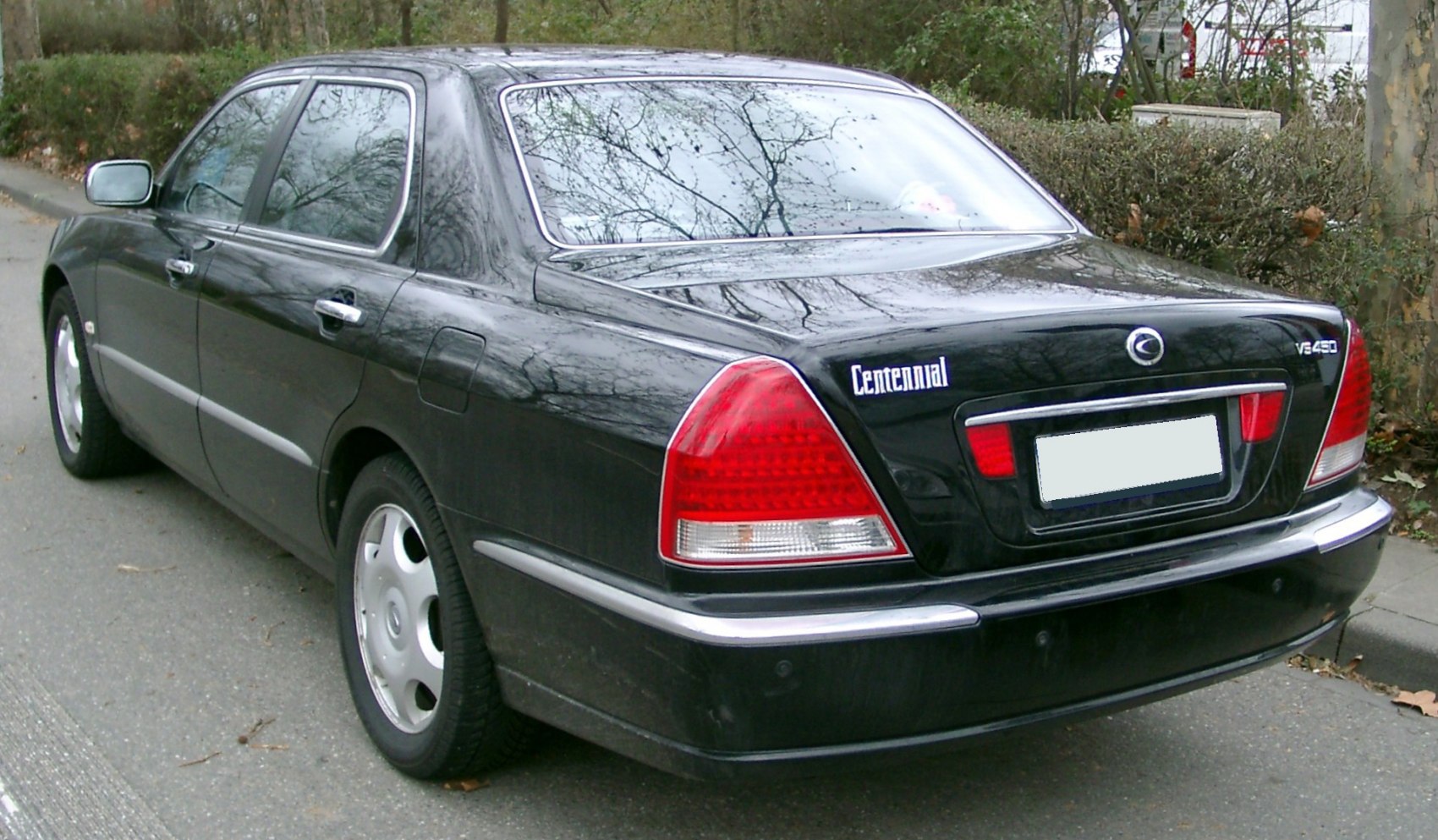 Rear view of luxury sedan with distinctive tail lights and chrome trim