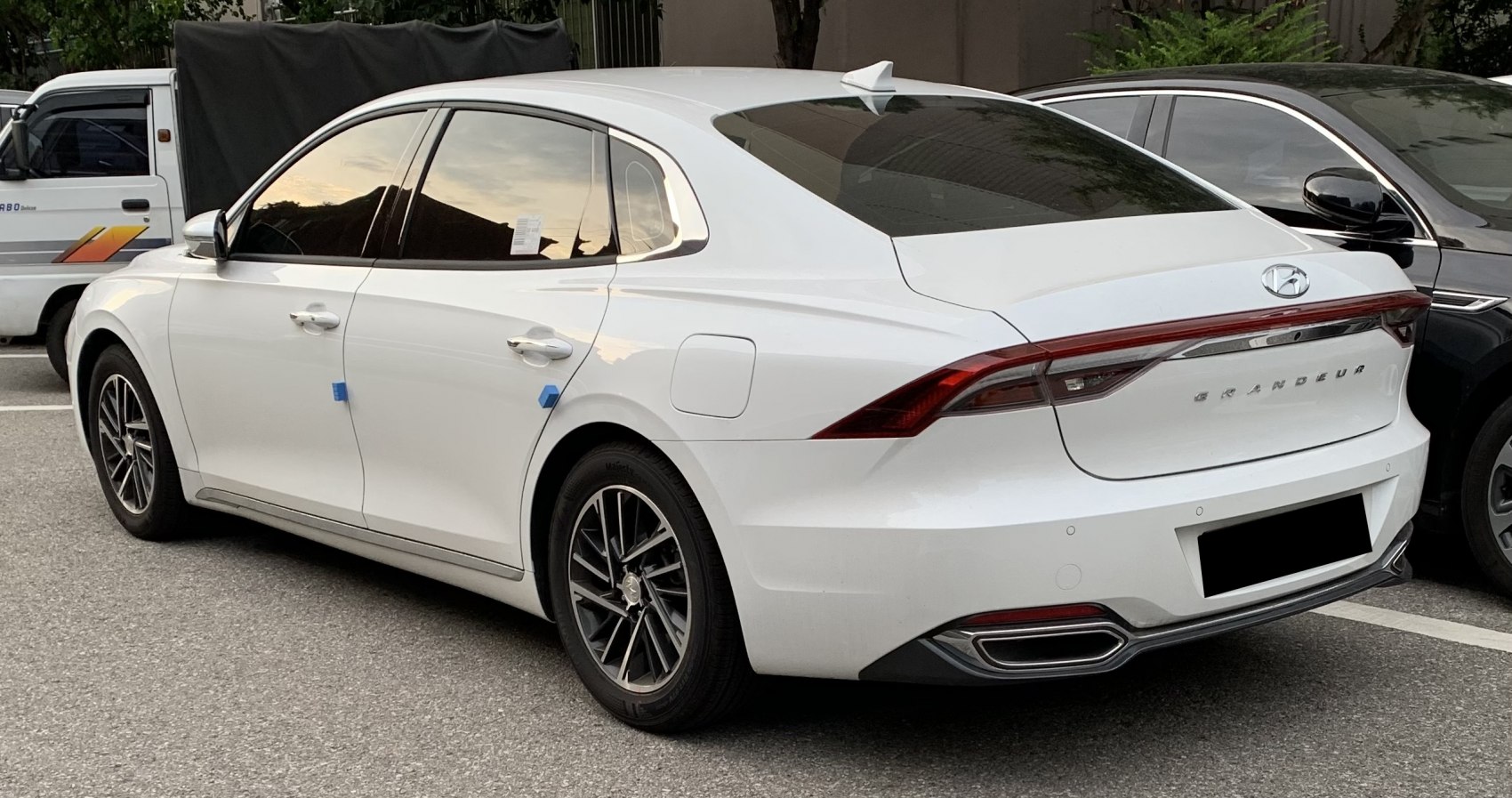 Rear side with LED tail lights and alloy wheels