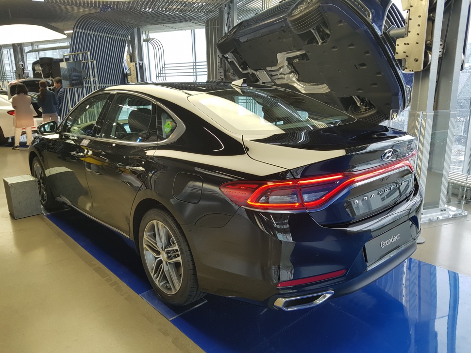 Rear design with LED continuous tail lights and dual exhausts.