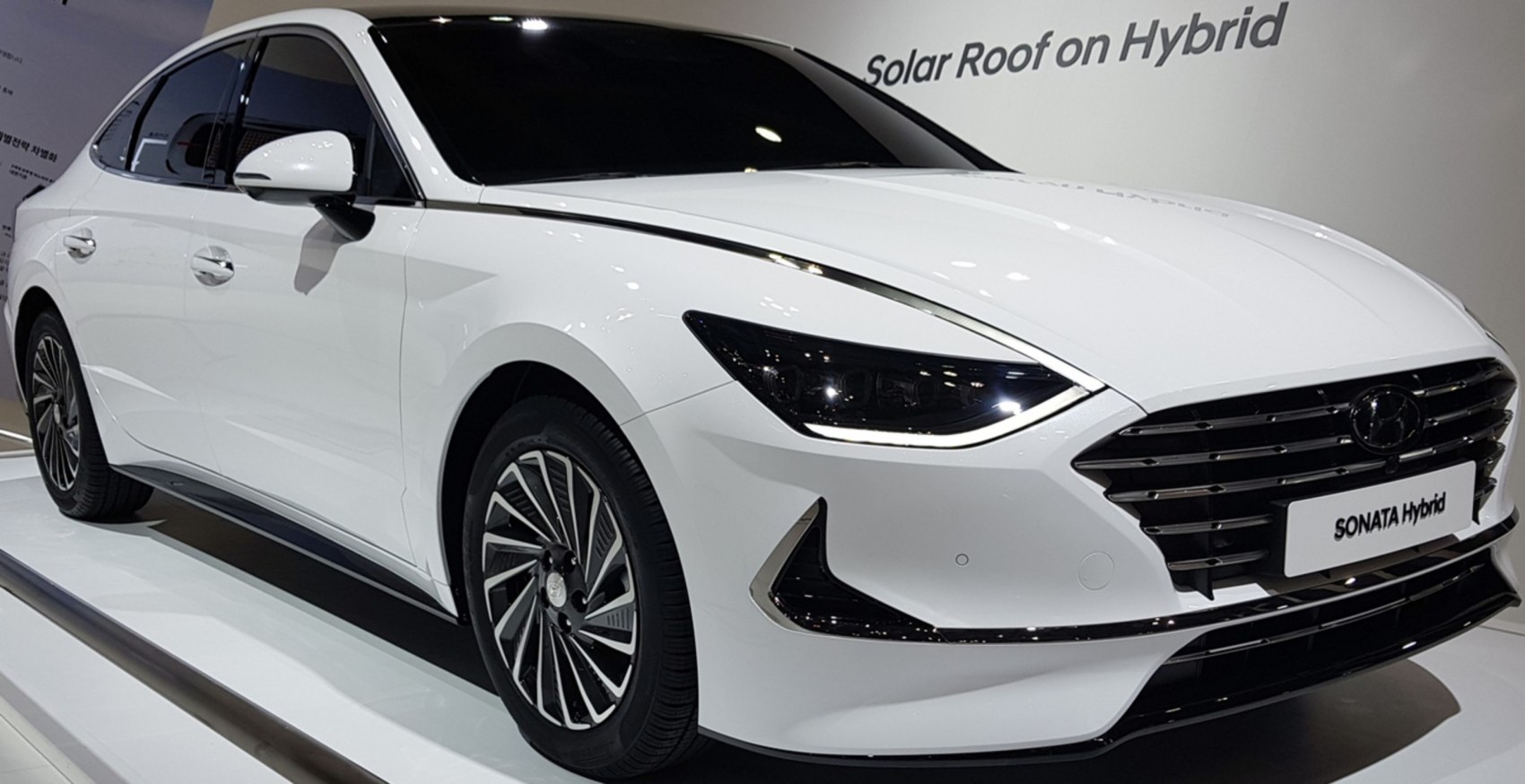 2020 Hybrid sedan front with LED headlights and sleek grille
