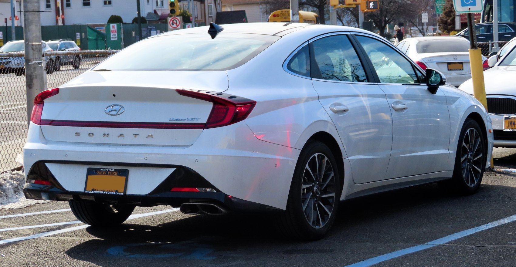 Rear three-quarter view with taillights and aerodynamic design