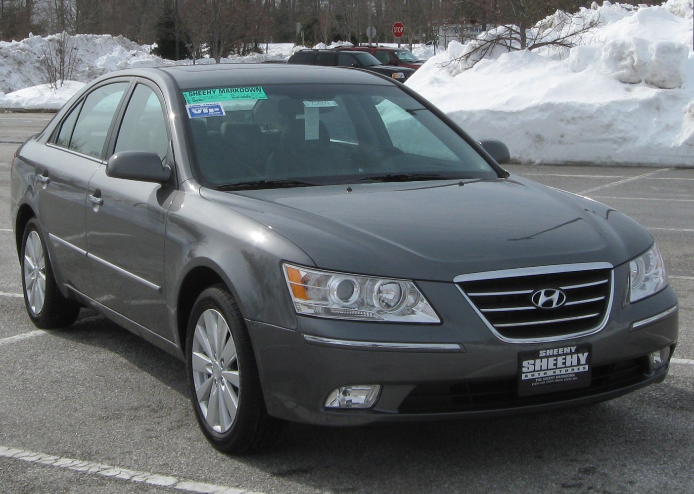 Mid-size sedan with sleek headlights and prominent chrome grille