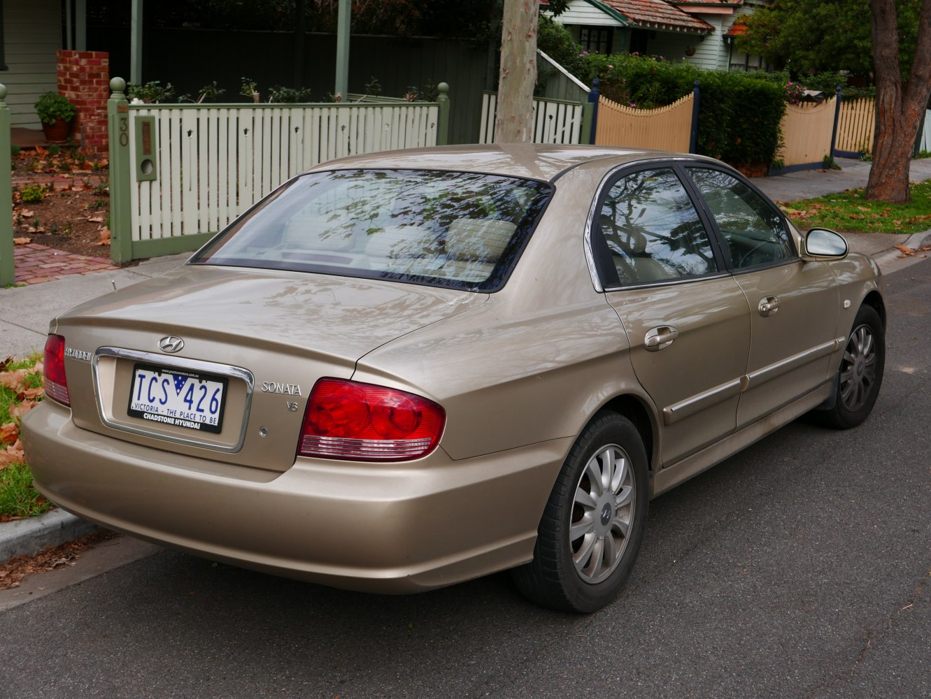 Rear and side view with distinct tail lights and alloy wheel covers