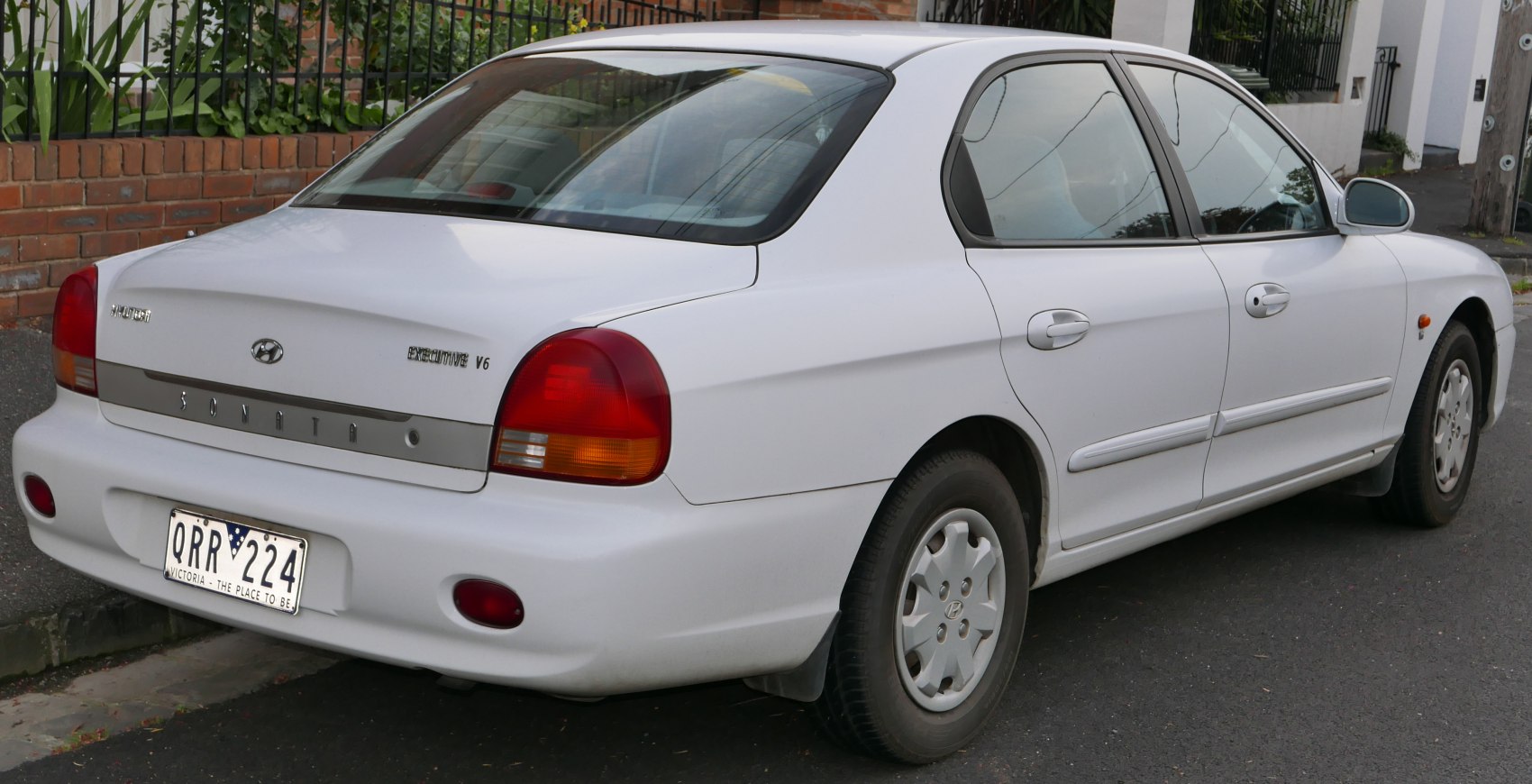 Rear and side profile of a classic 1998-2001 four-door sedan.