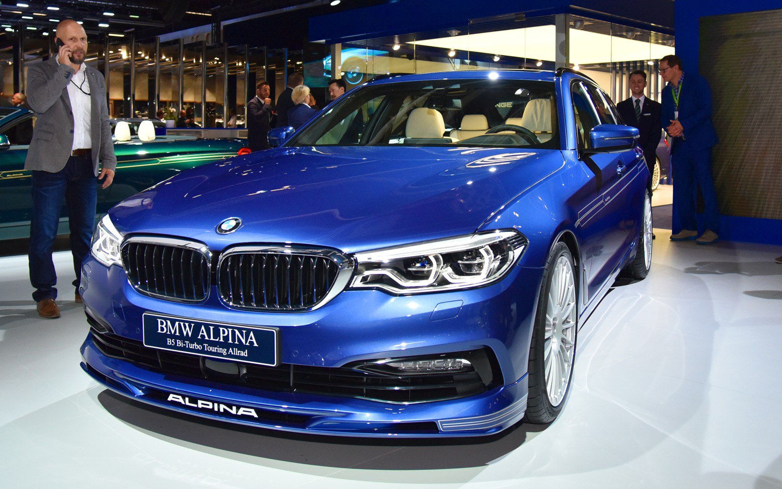 Front grille and headlights of a blue luxury station wagon