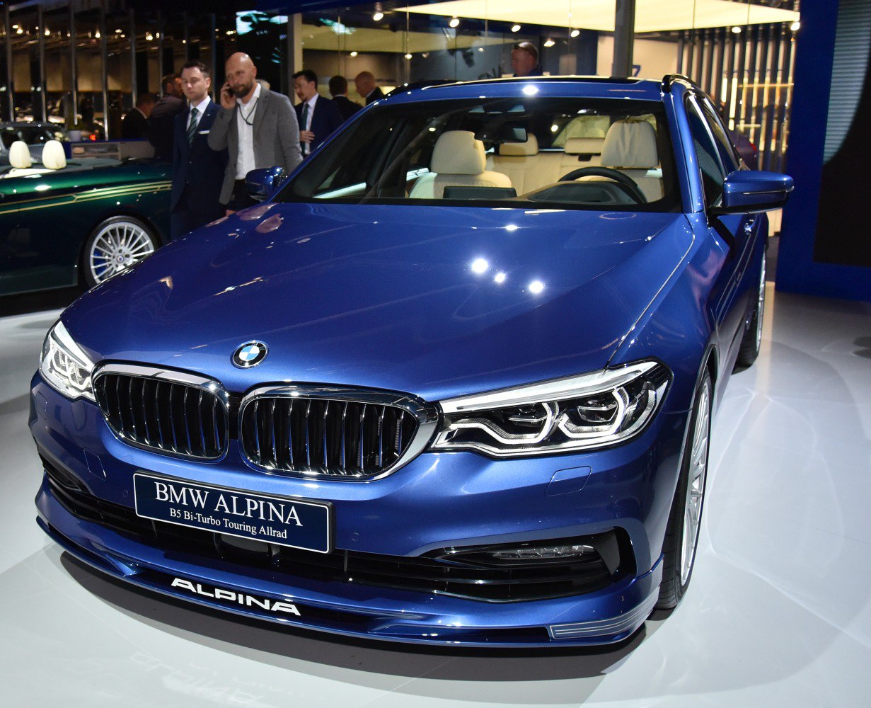 Close-up of front grille and headlights of luxury touring car