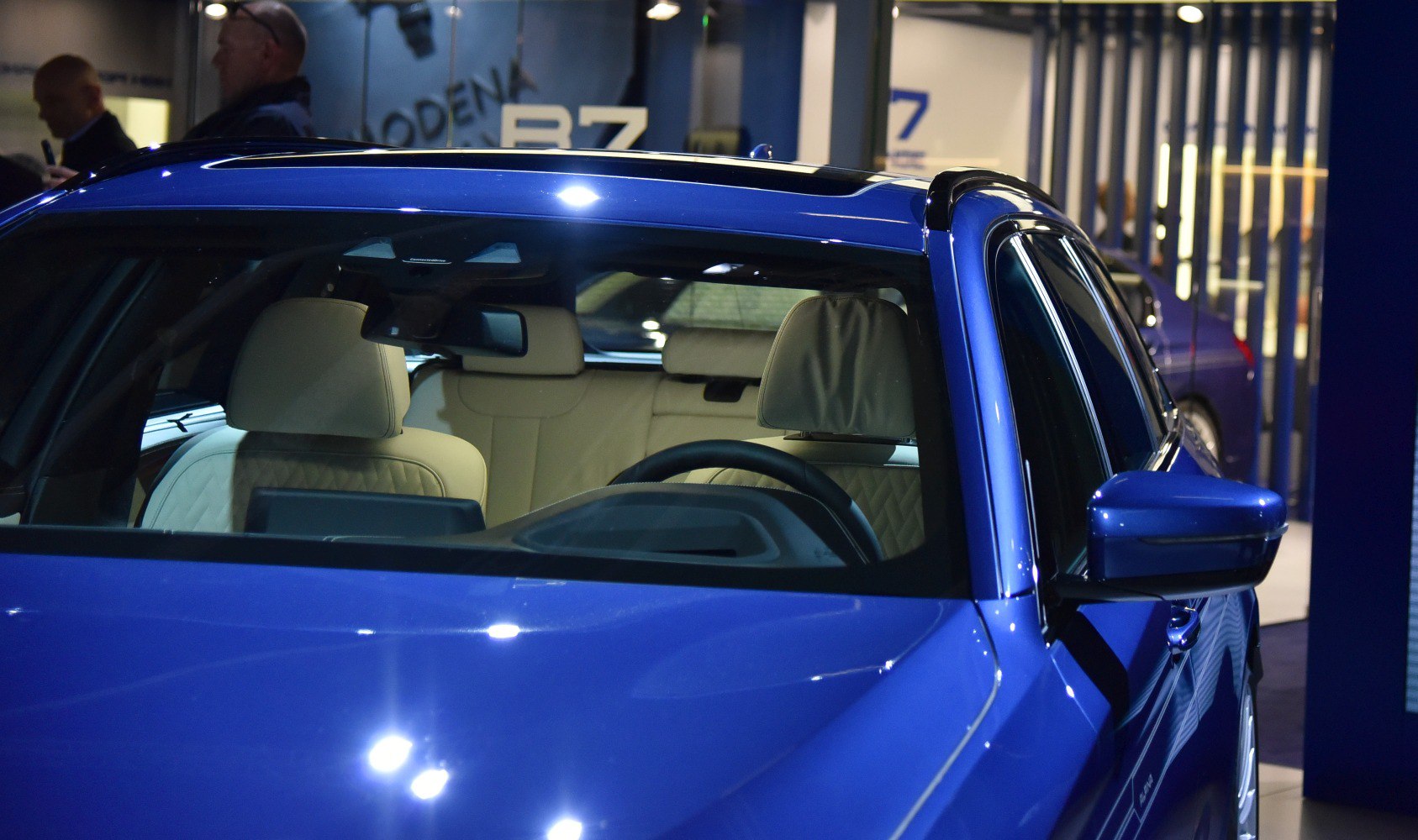 Blue estate car with quilted beige leather interior and panoramic sunroof